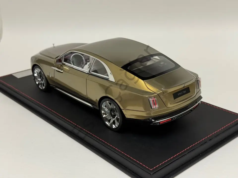 1:18 DF Models Rolls Royce Spectre in Gold limited on a black leather base