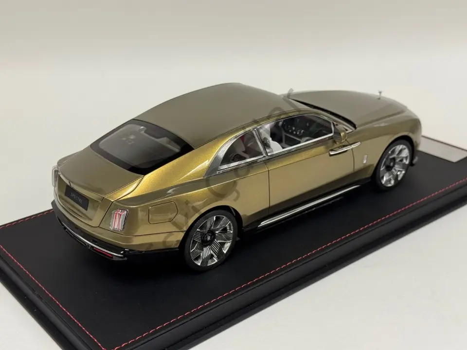 1:18 DF Models Rolls Royce Spectre in Gold limited on a black leather base