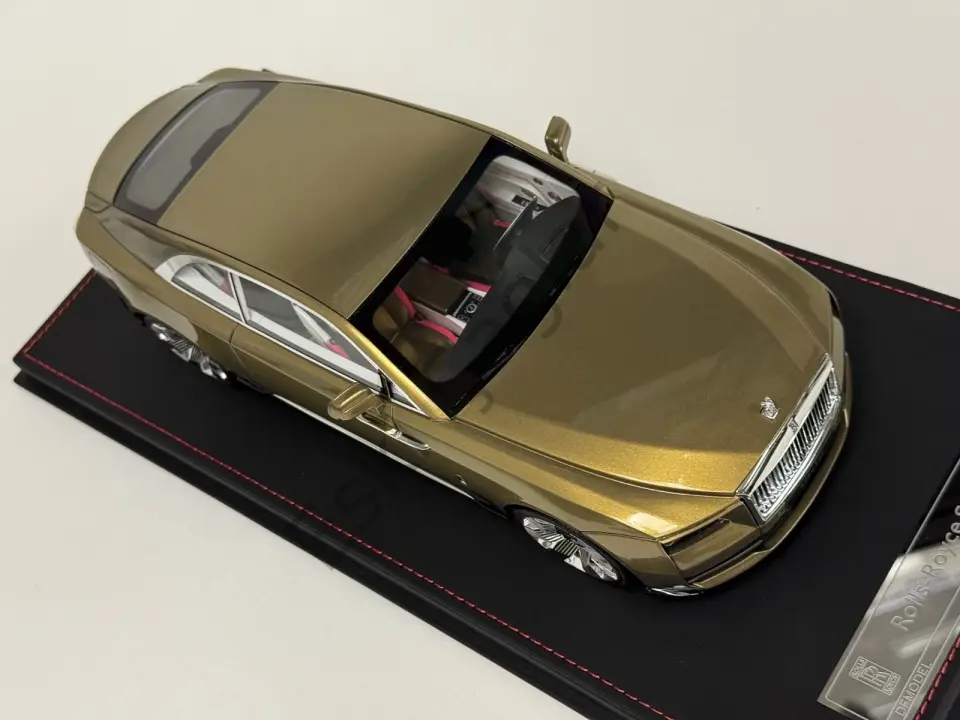 1:18 DF Models Rolls Royce Spectre in Gold limited on a black leather base